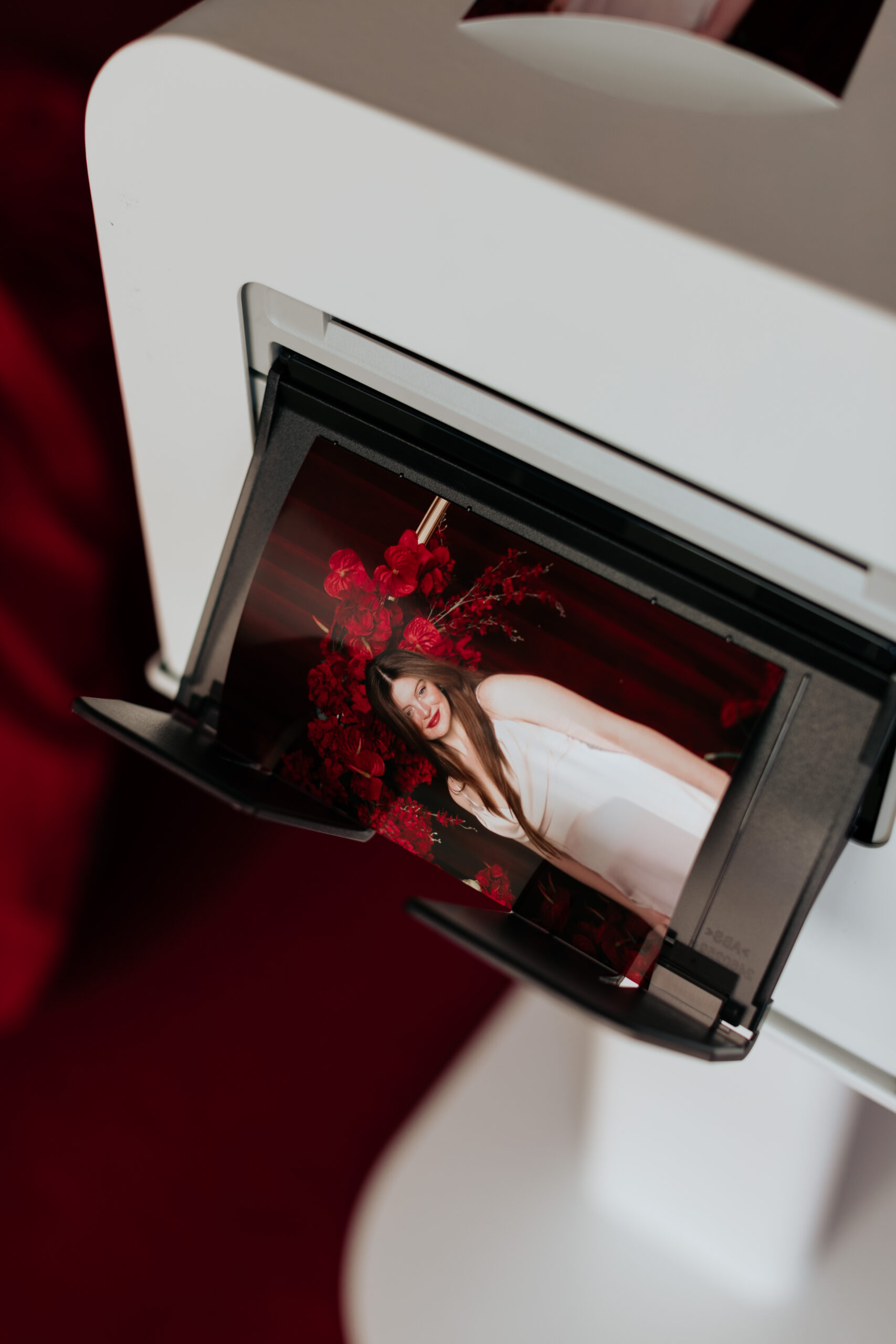 Guests using print photo booth at wedding in Massachusetts