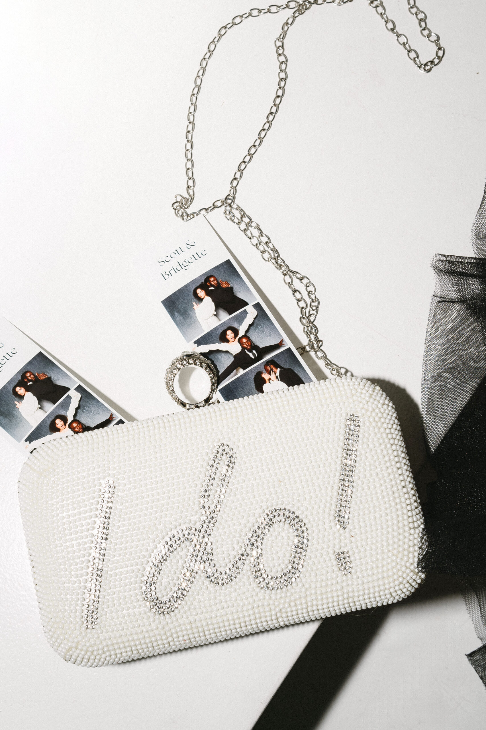 Wedding guests holding custom photo booth prints in Massachusetts